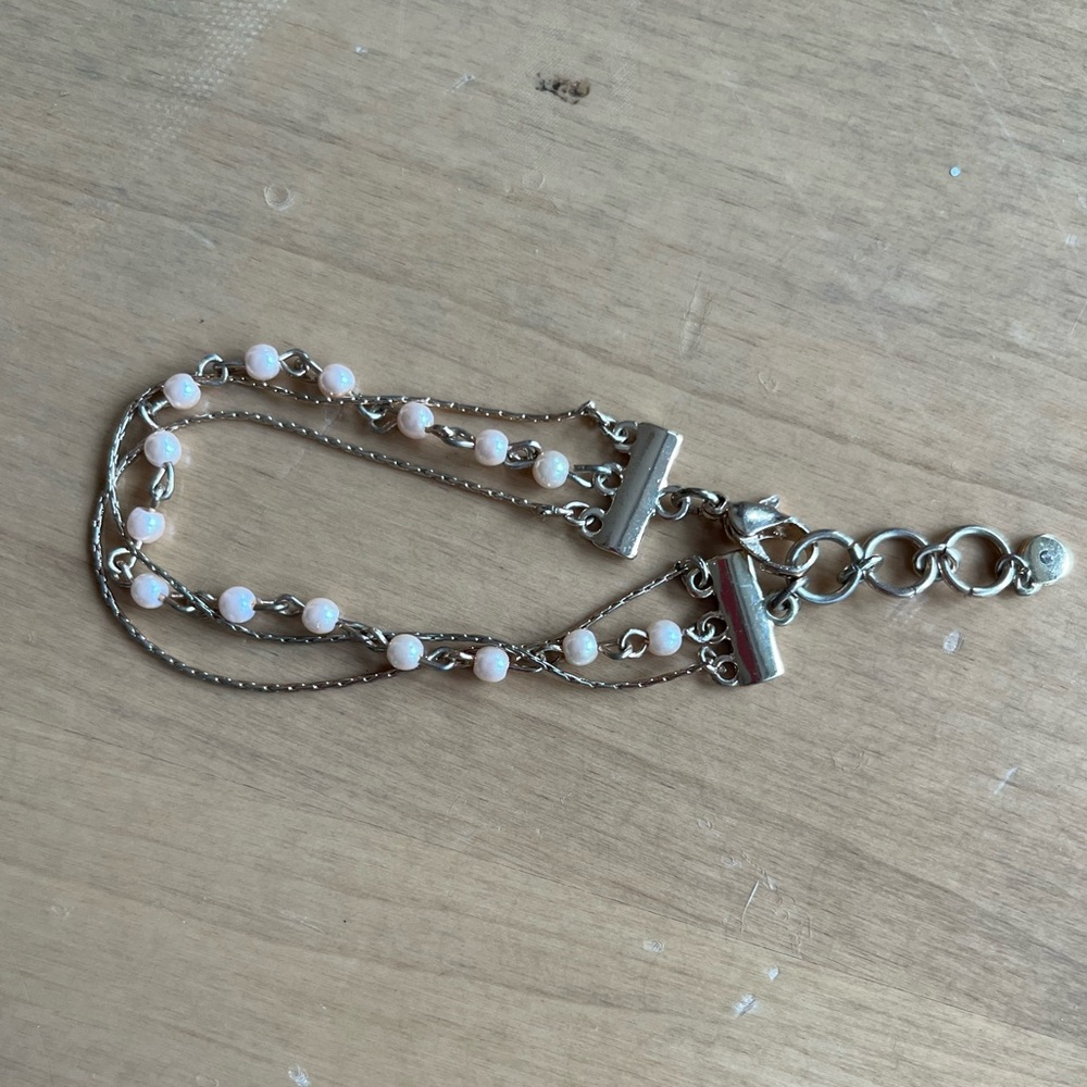 Layered gold and pearl bracelet